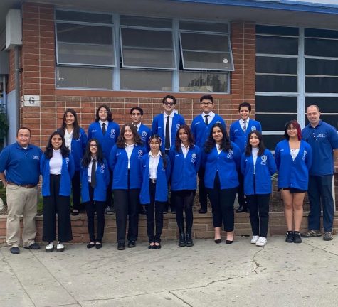 Academic decathlon team poses for their yearbook photo with coaches Mr. Melgar and Mr. Francis.
