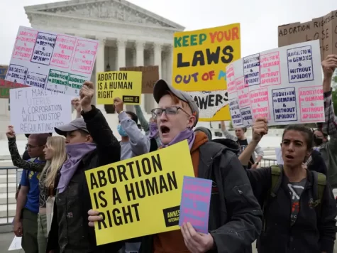 Pro-choice protestors standing outside of the US Supreme Court after news of a leaked draft to overturn Roe v. Wade. Alex Wong/Getty Images