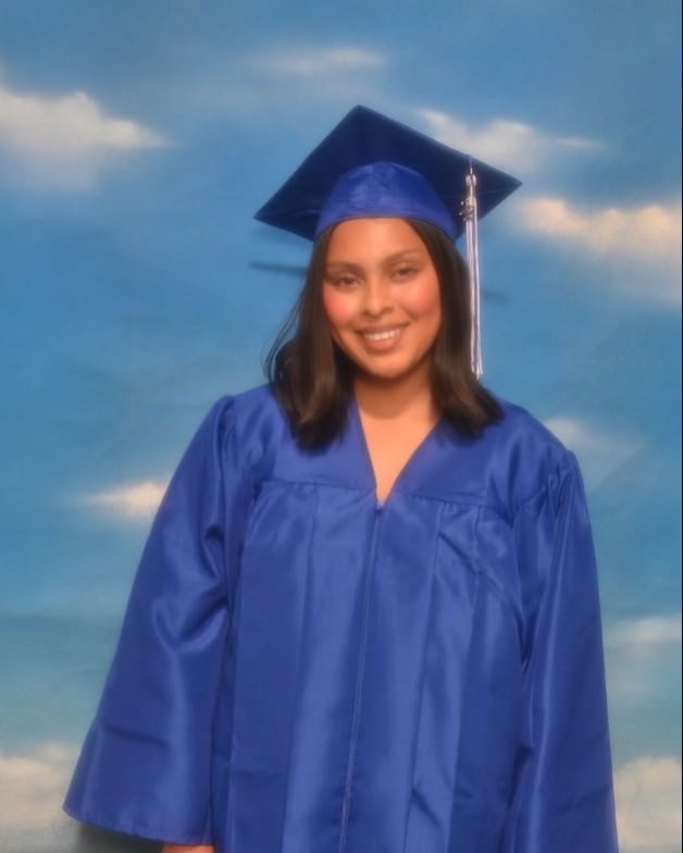 Senior+staff+member+Yaileen+with+her+cap+and+gown.